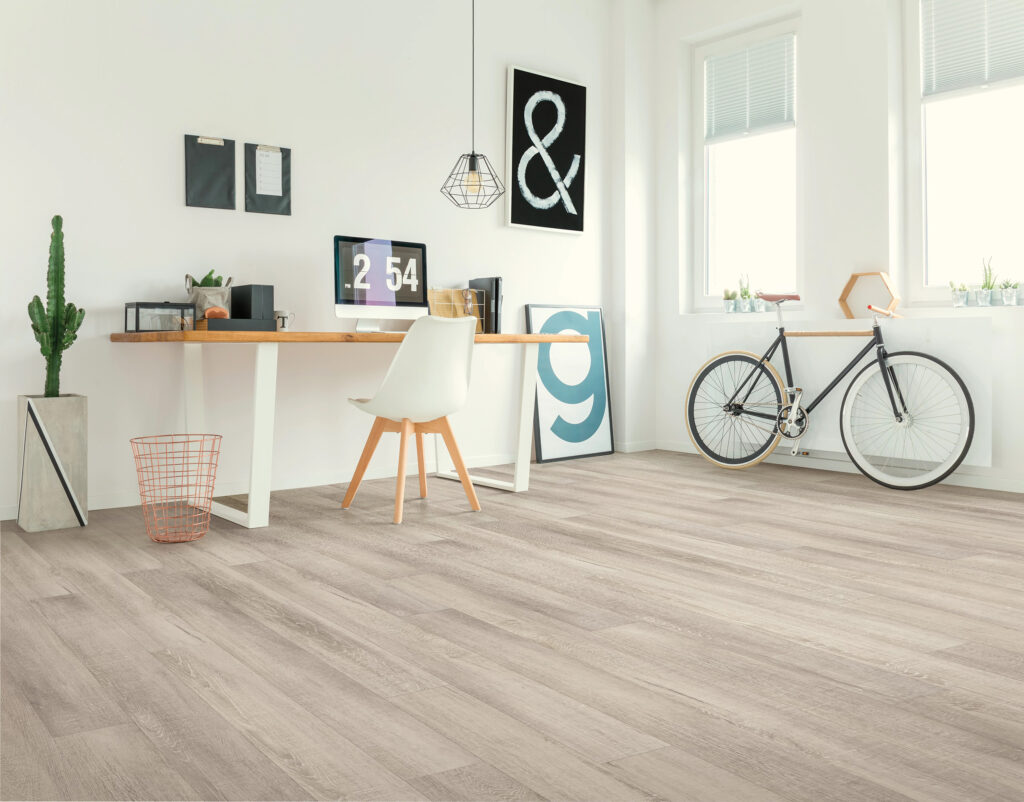 Pet-friendly waterproof vinyl flooring in a bright modern home office | Bay Country Floors
